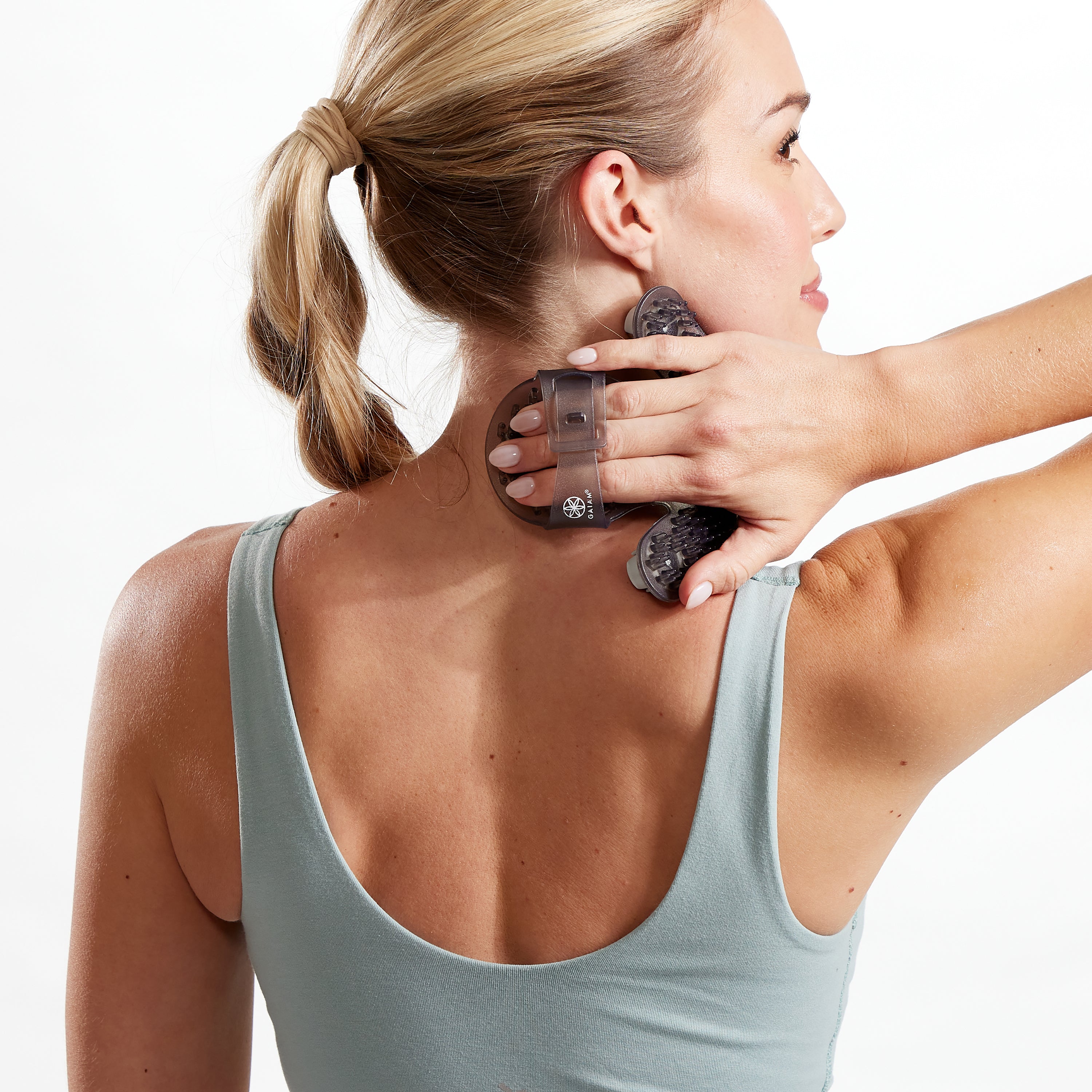 Person using the Hand-Held Rolling Massager on the neck